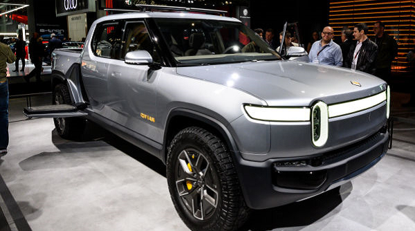 Rivian says its electric vehicles will cost less than first announced